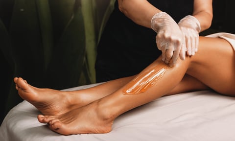 Professional waxing hair removal, warm wax application detail